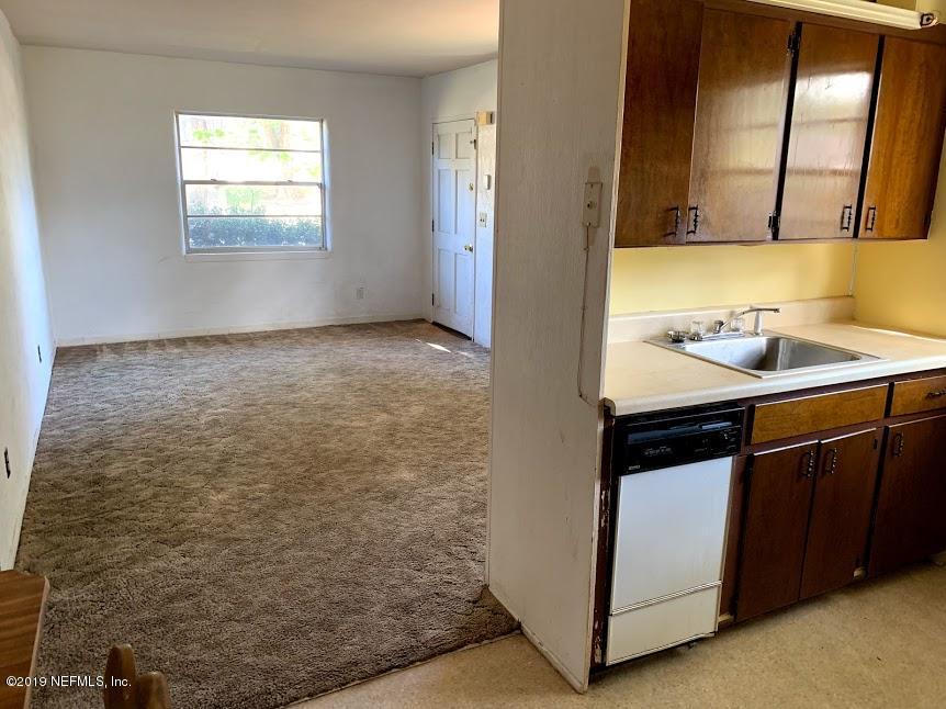 6744 Gamewell Road Jacksonville, FL 32211 - Photo 10 of 14 a kitchen with a sink and a stove