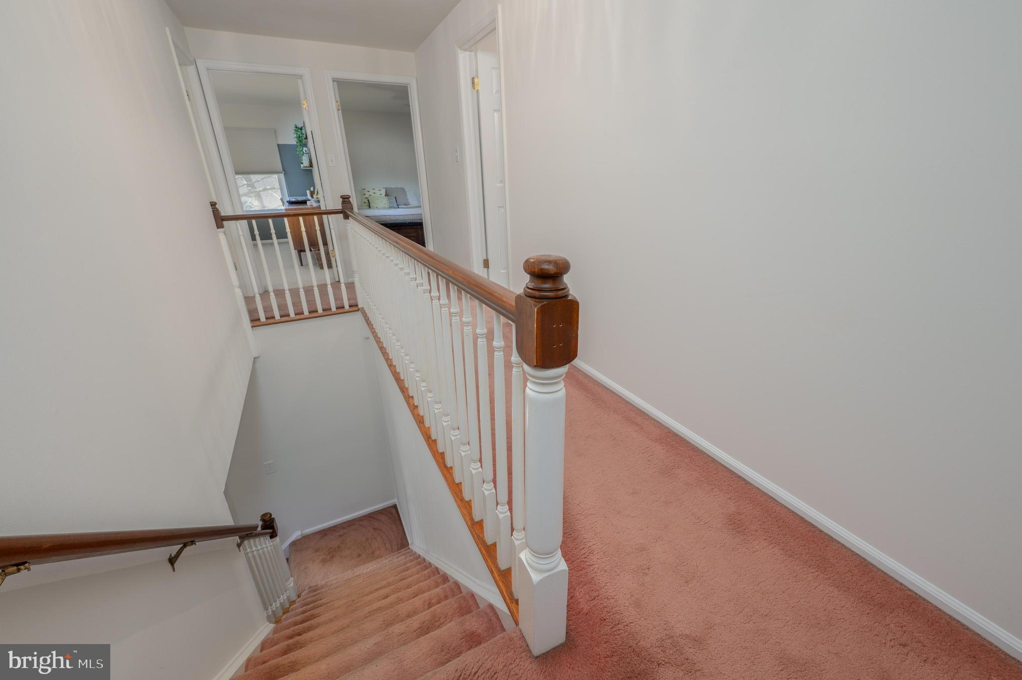 596 Sentinel Road Moorestown, NJ 08057 - Photo 17 of 31 a view of a hallway with wooden floor and staircase