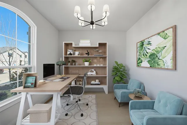 a work room with furniture and a window