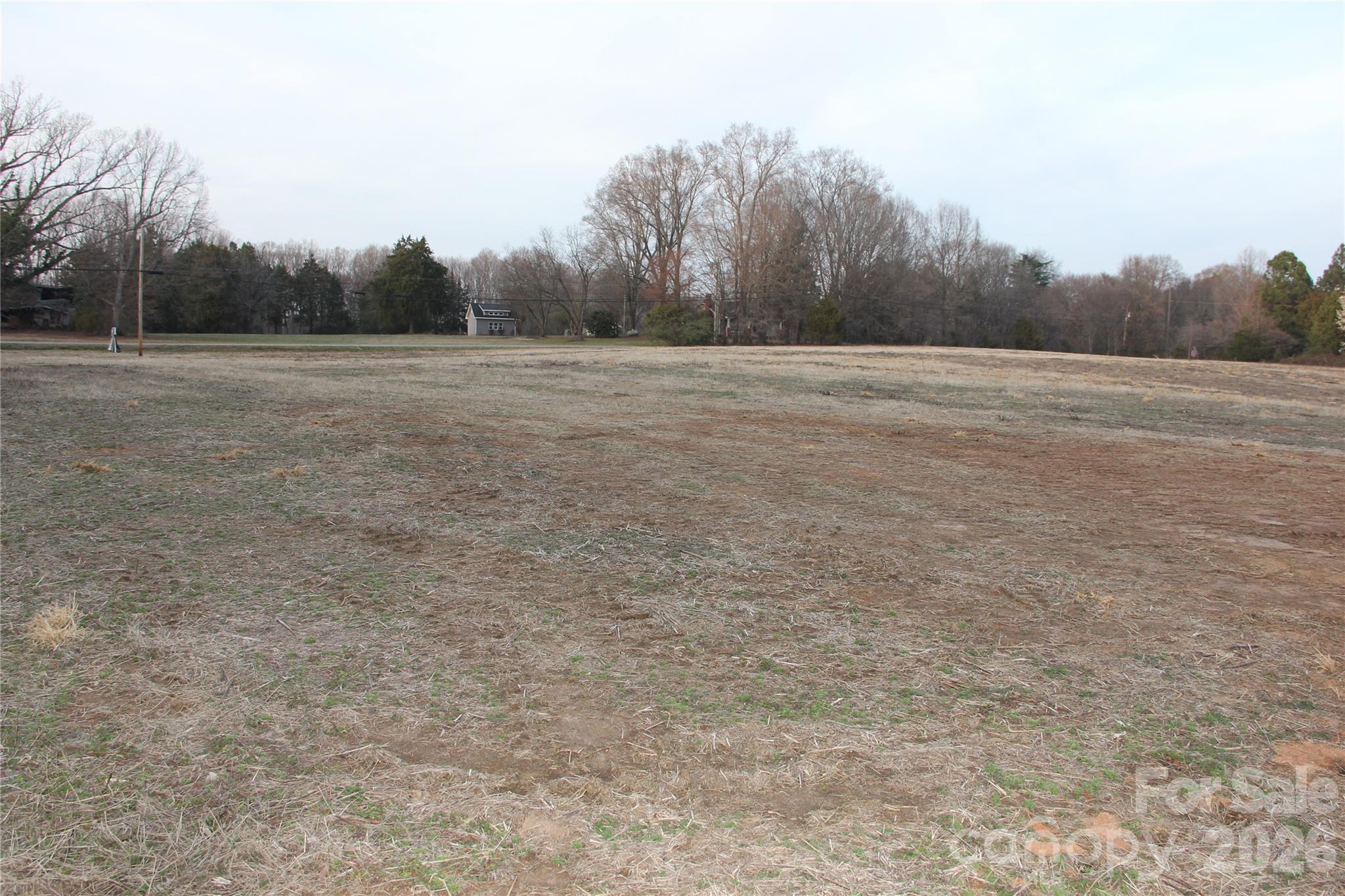 6380 Pagemont Road Kannapolis, NC 28081 - Photo 3 of 18 a view of a field with trees in background