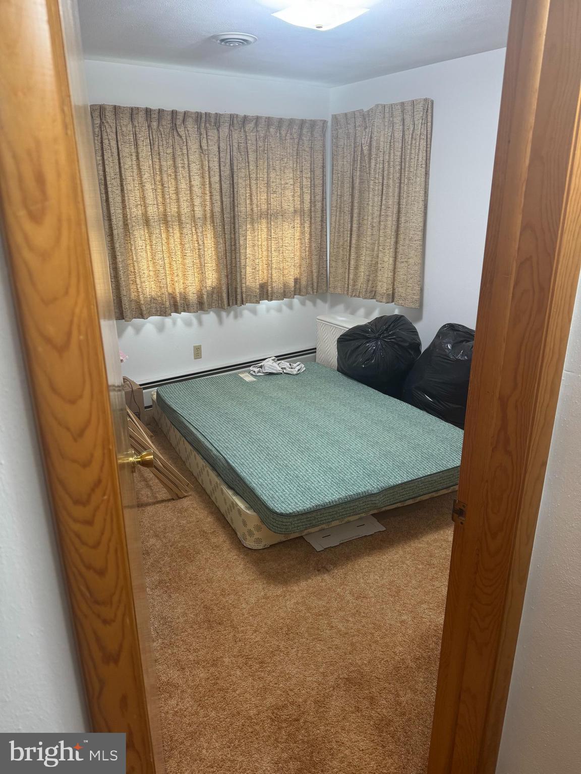 1500 Ridge Road Wellsville, PA 17365 - Photo 16 of 56 a room with a bed and large window