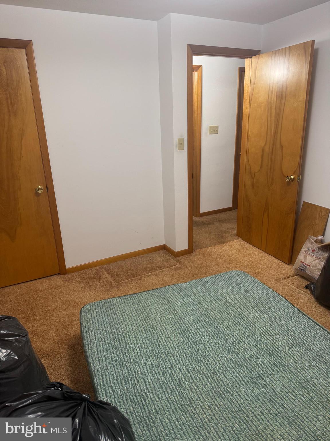 1500 Ridge Road Wellsville, PA 17365 - Photo 17 of 56 a bedroom with a bed and a mirror