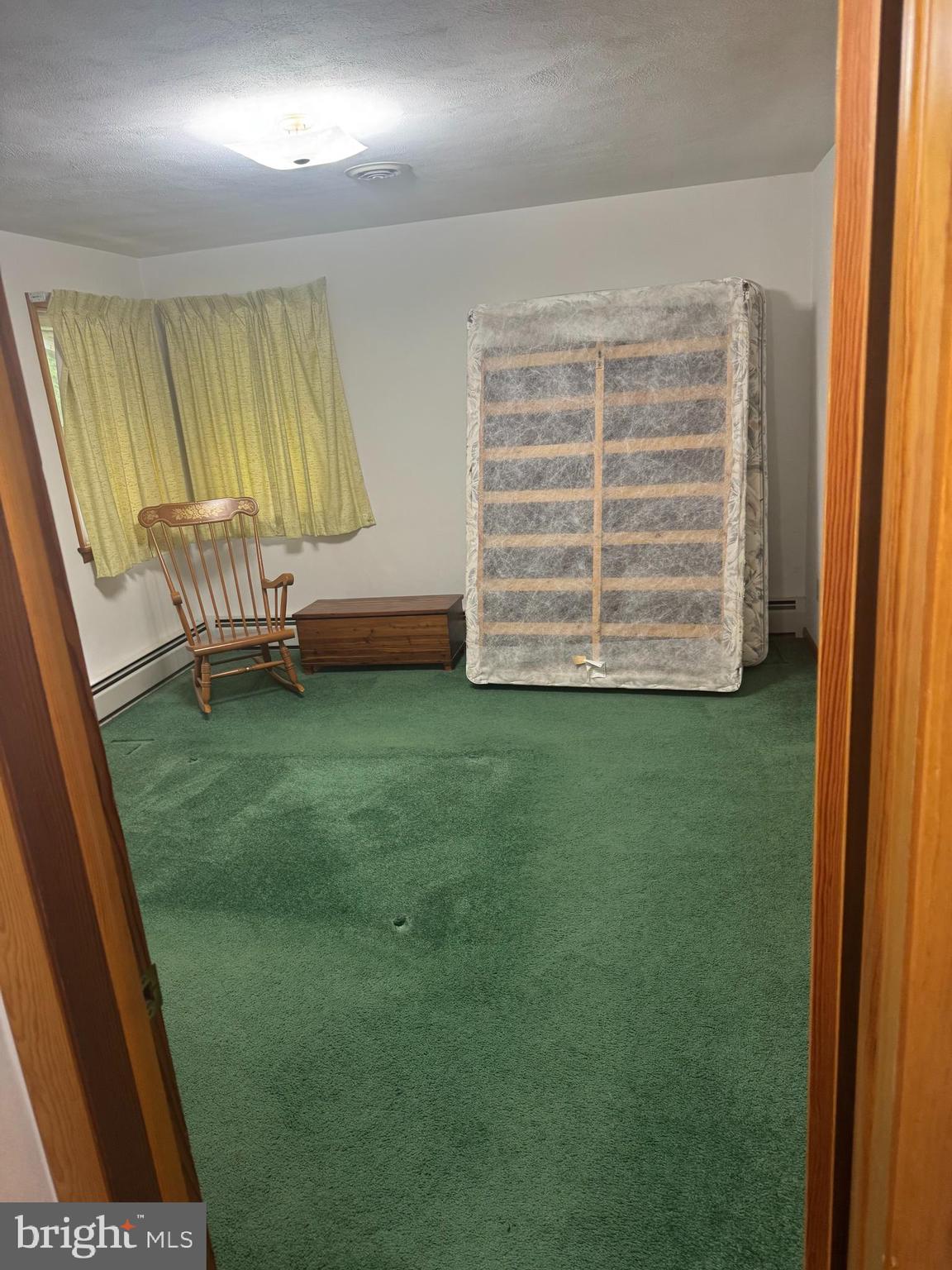 1500 Ridge Road Wellsville, PA 17365 - Photo 18 of 56 a room with a chair and a window