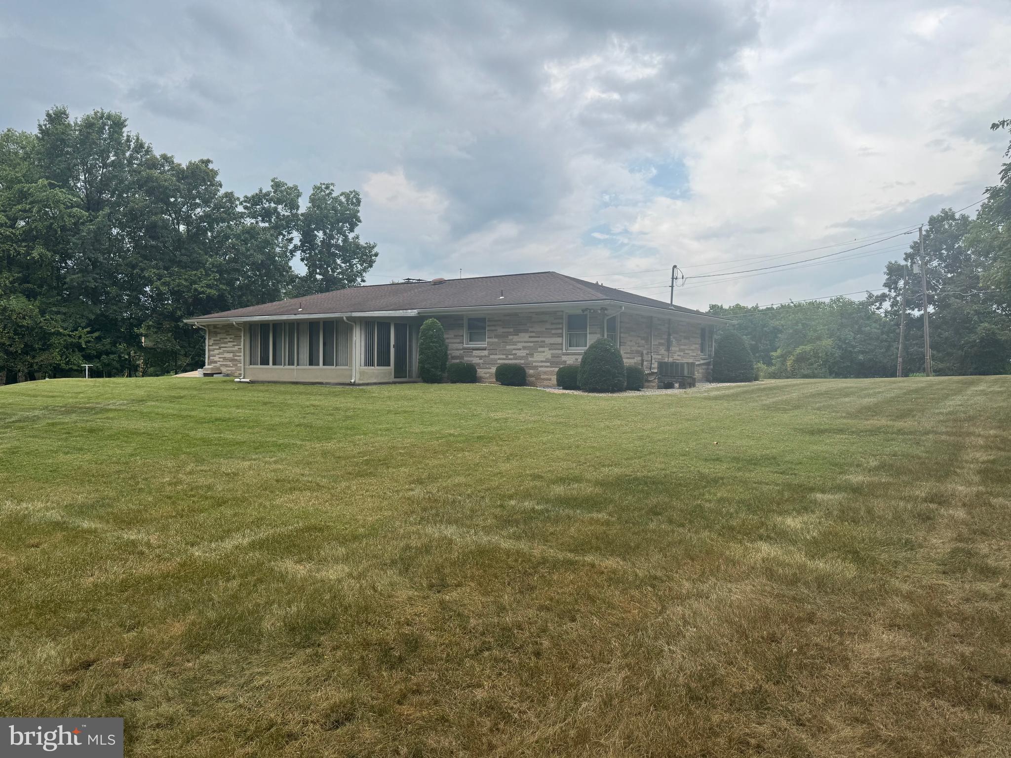 1500 Ridge Road Wellsville, PA 17365 - Photo 2 of 56 a view of a house with a yard and a large tree