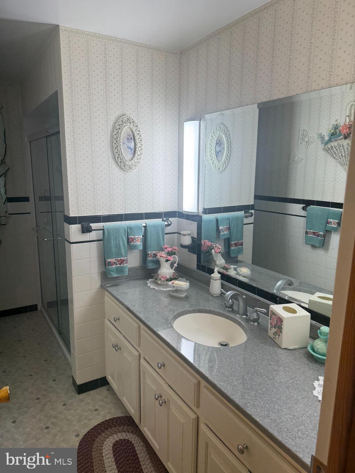 1500 Ridge Road Wellsville, PA 17365 - Photo 22 of 56 a bathroom with a granite countertop sink and a mirror