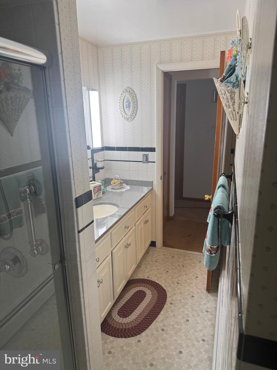 1500 Ridge Road Wellsville, PA 17365 - Photo 24 of 56 a bathroom with a sink a mirror and shower