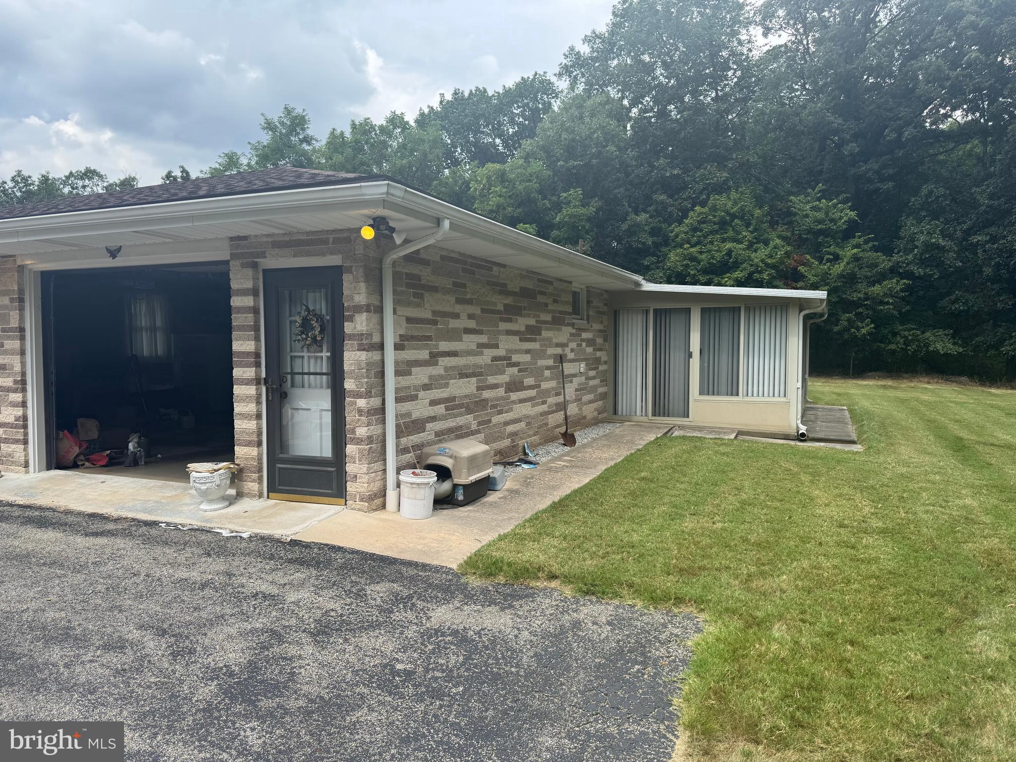 1500 Ridge Road Wellsville, PA 17365 - Photo 5 of 56 a view of a house with a yard and garage