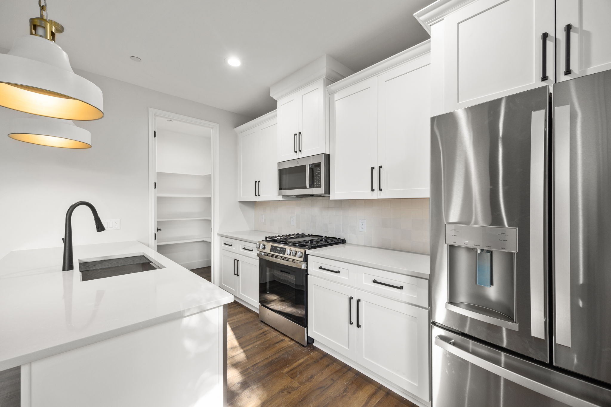 4611 Dewberry Street, Unit C Houston, TX 77021 - Photo 18 of 34 a kitchen with stainless steel appliances granite countertop a refrigerator sink and stove