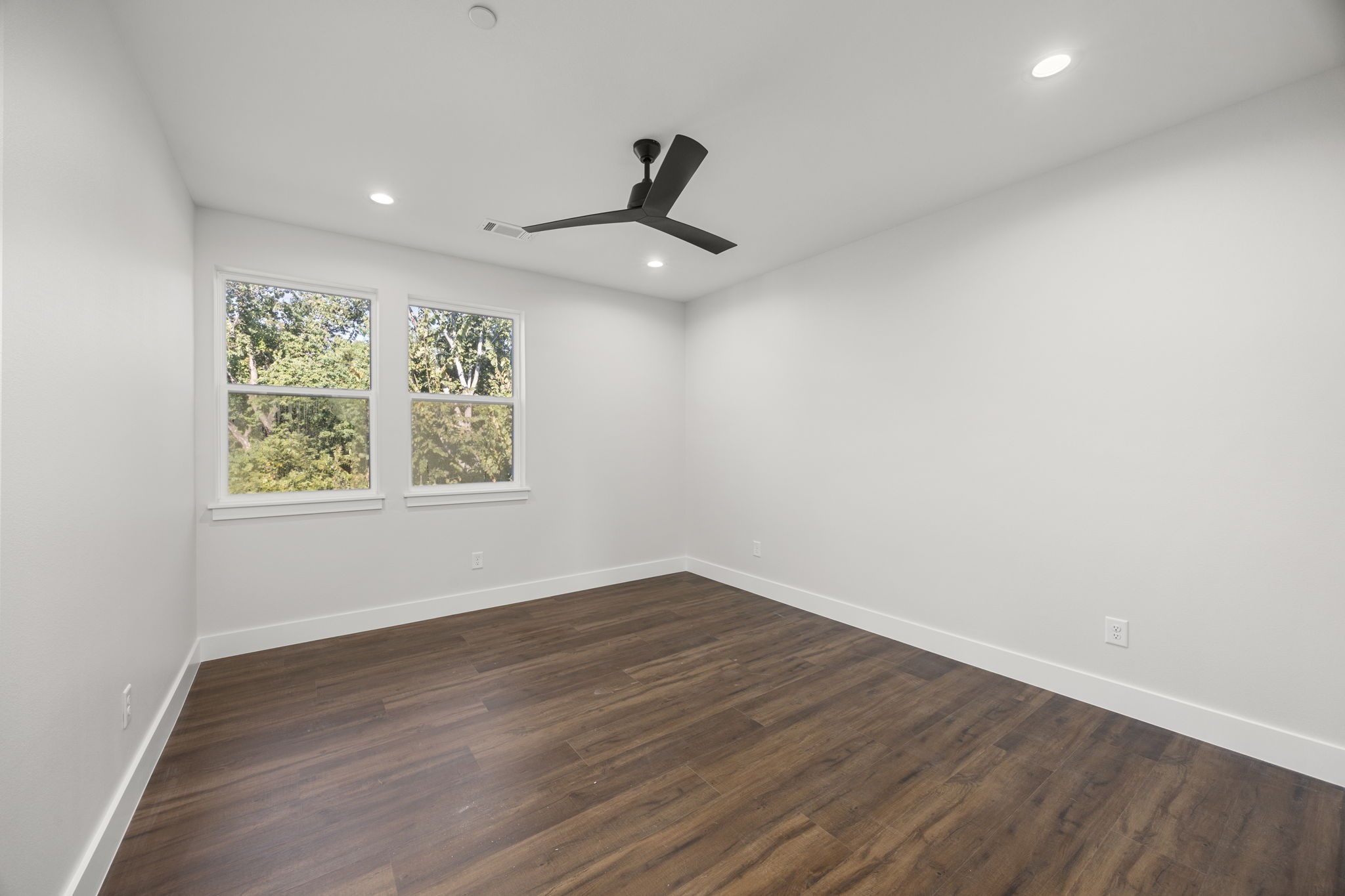4611 Dewberry Street, Unit C Houston, TX 77021 - Photo 25 of 34 wooden floor in an empty room with a window
