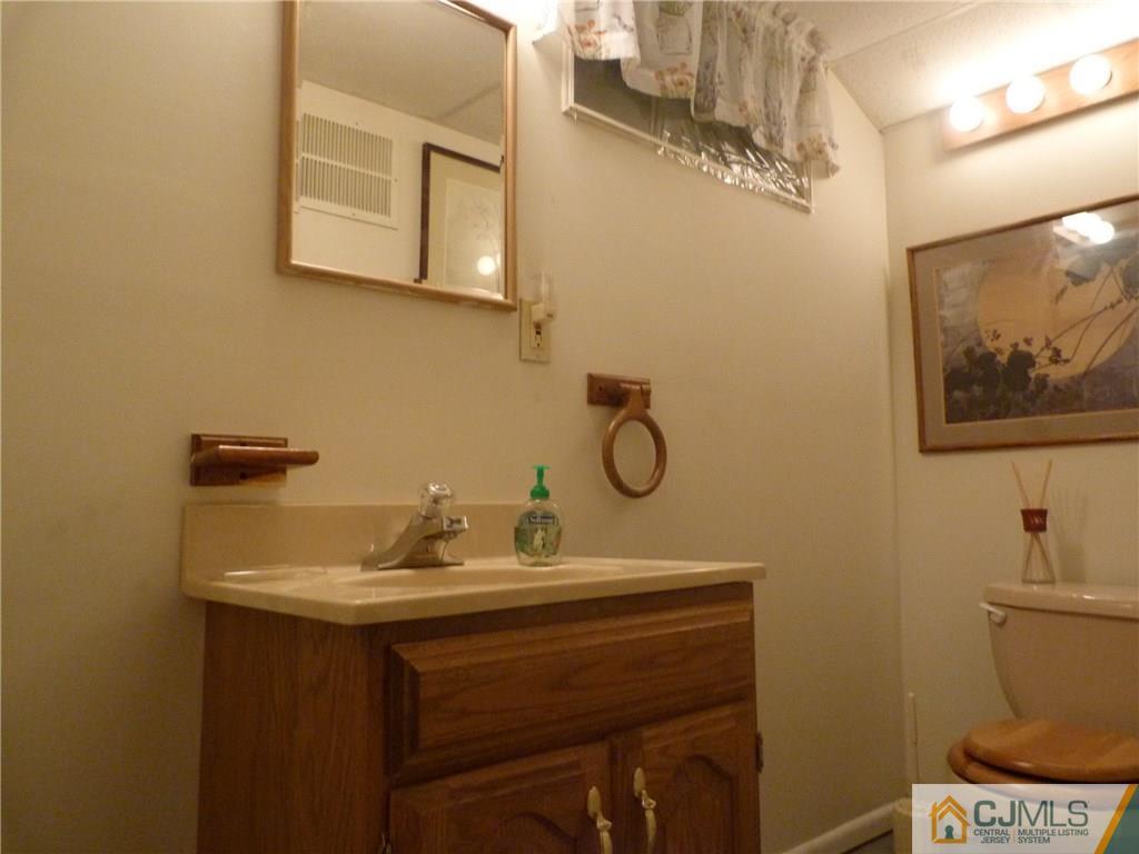 45 South Pennington Road New Brunswick, NJ 08901 - Photo 14 of 21 a bathroom with a sink and a mirror