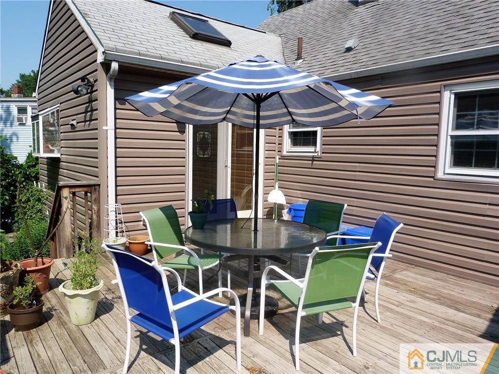 45 South Pennington Road New Brunswick, NJ 08901 - Photo 15 of 21 a view of a patio with a table and chairs