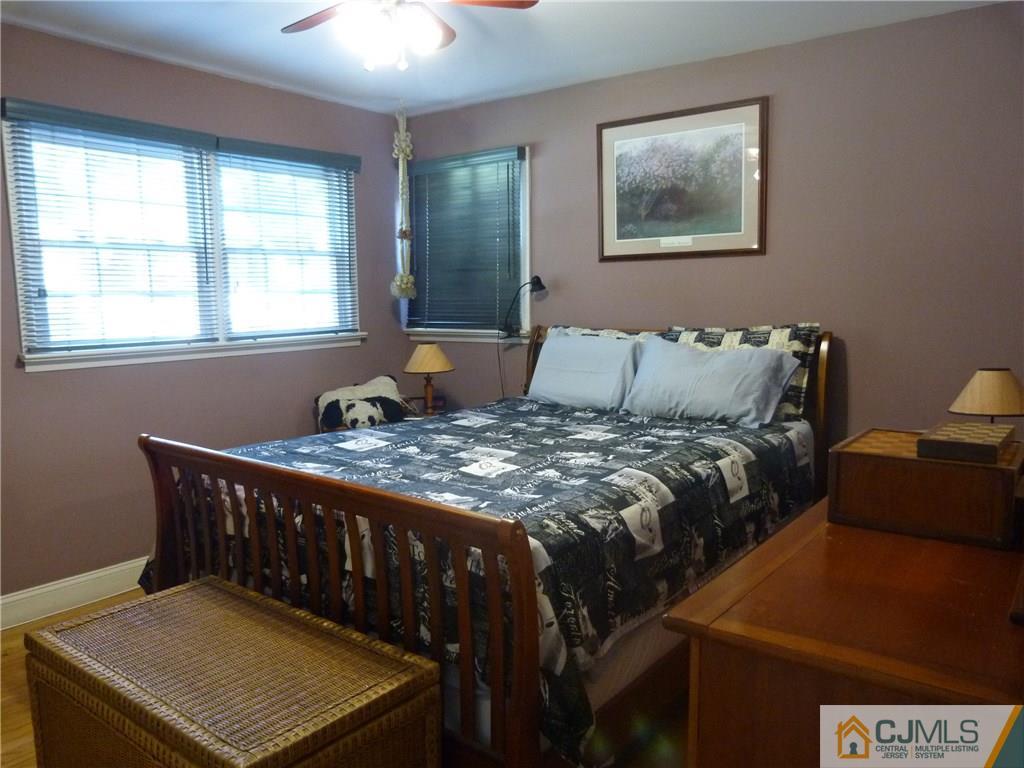 45 South Pennington Road New Brunswick, NJ 08901 - Photo 8 of 21 a bed sitting in a bedroom next to a window