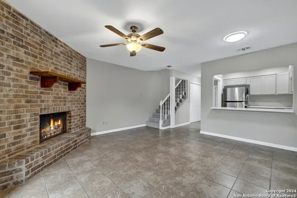 a view of an empty room and fire place
