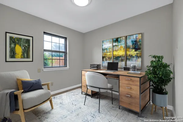 a living room with furniture and window