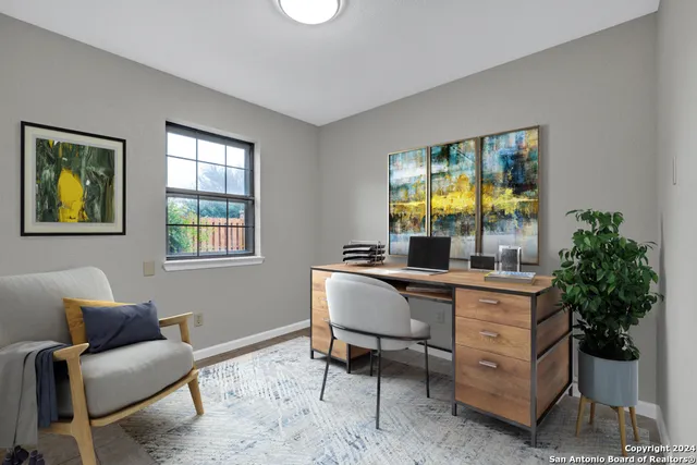 a living room with furniture and window