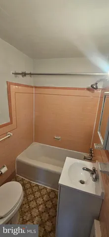 a bathroom with a sink and toilet