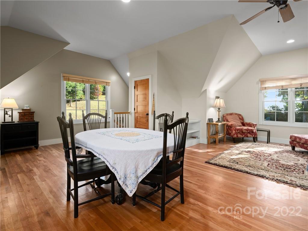 116 Stone Brook Trail Black Mountain, NC 28711 - Photo 14 of 48 a view of a dining room with furniture window and wooden floor
