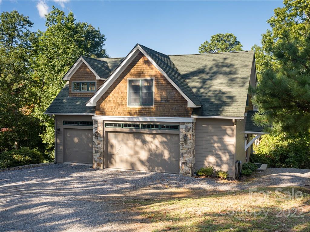 116 Stone Brook Trail Black Mountain, NC 28711 - Photo 2 of 48 a view of a house with a yard and garage