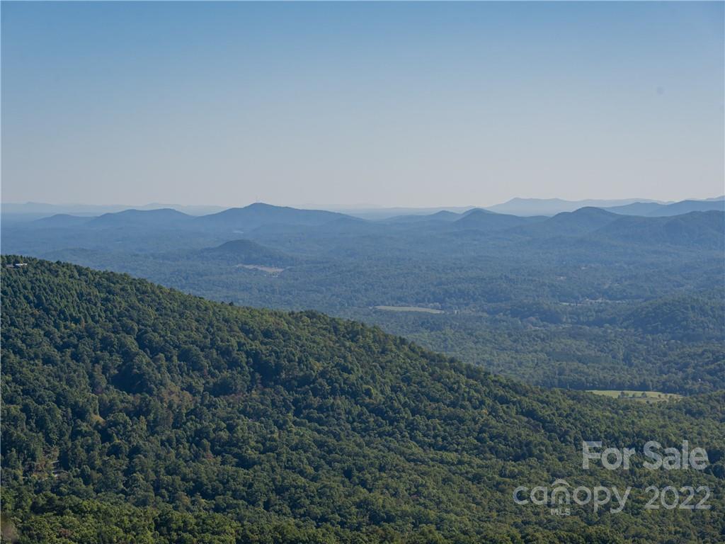 116 Stone Brook Trail Black Mountain, NC 28711 - Photo 32 of 48 a view of a mountain range with a lush green hillside