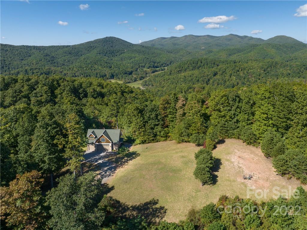 116 Stone Brook Trail Black Mountain, NC 28711 - Photo 40 of 48 a view of a lake in middle of forest