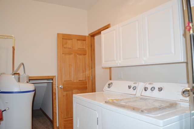 10187 Marblewing Road, Unit 2 Roscoe, IL 61073 - Photo 11 of 12 a utility room with a sink dryer and washer