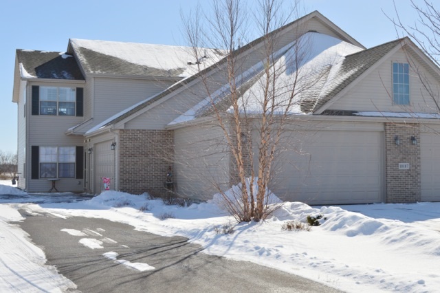 10187 Marblewing Road, Unit 2 Roscoe, IL 61073 - Photo 3 of 12 a view of a house with a snow in the background