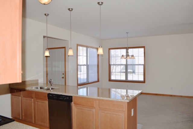 10187 Marblewing Road, Unit 2 Roscoe, IL 61073 - Photo 6 of 12 a bathroom with a granite countertop sink and a large mirror