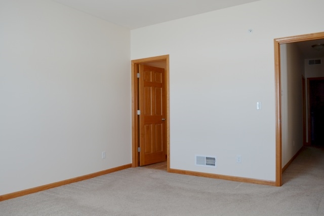 10187 Marblewing Road, Unit 2 Roscoe, IL 61073 - Photo 8 of 12 an empty room with closet