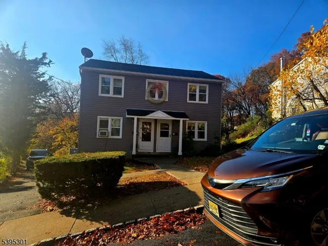 a front view of a house with swimming pool