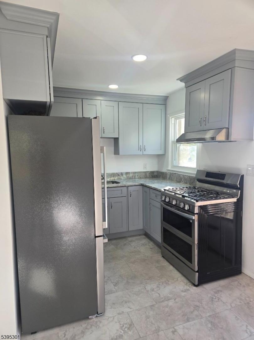 14 West Sterling Street, Unit 2 Wharton, NJ 07885 - Photo 11 of 35 a kitchen with stainless steel appliances granite countertop a refrigerator a stove and a sink