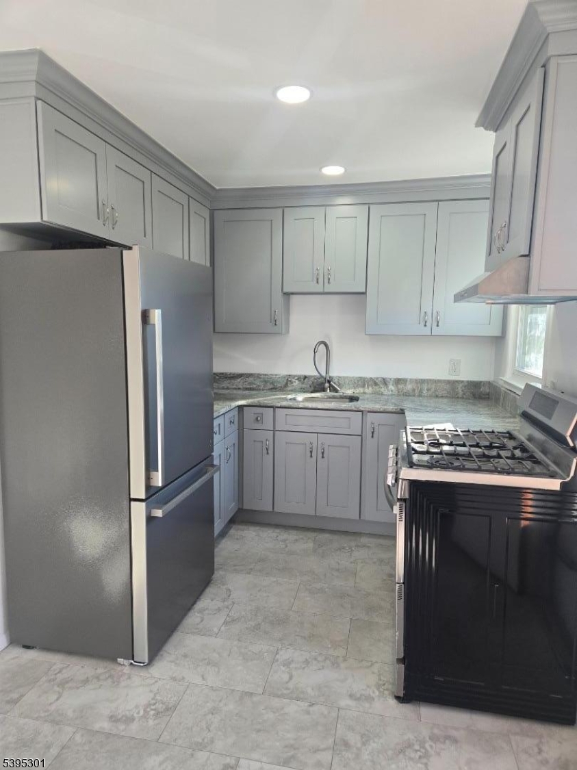 14 West Sterling Street, Unit 2 Wharton, NJ 07885 - Photo 12 of 35 a kitchen with stainless steel appliances granite countertop a stove a refrigerator and a sink