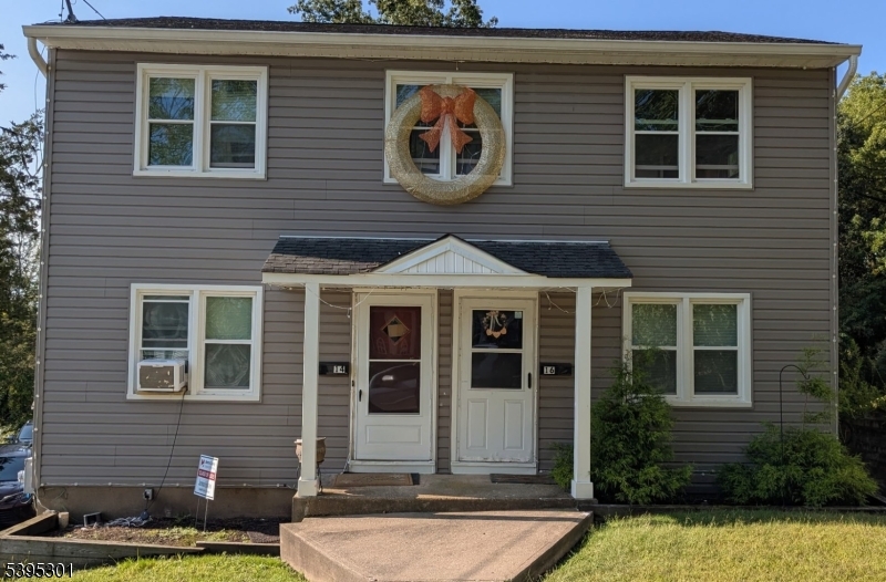 14 West Sterling Street, Unit 2 Wharton, NJ 07885 - Photo 2 of 35 a front view of a house with garden