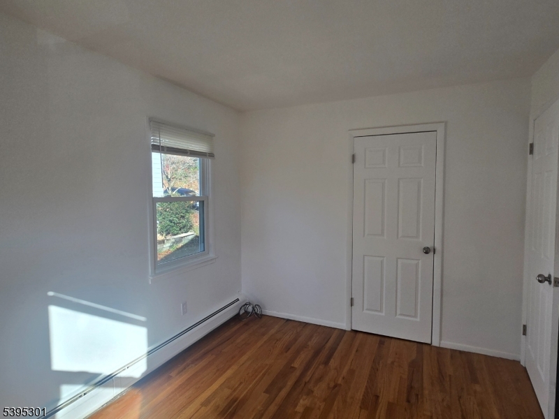 14 West Sterling Street, Unit 2 Wharton, NJ 07885 - Photo 25 of 35 a view of an empty room with closet and a window
