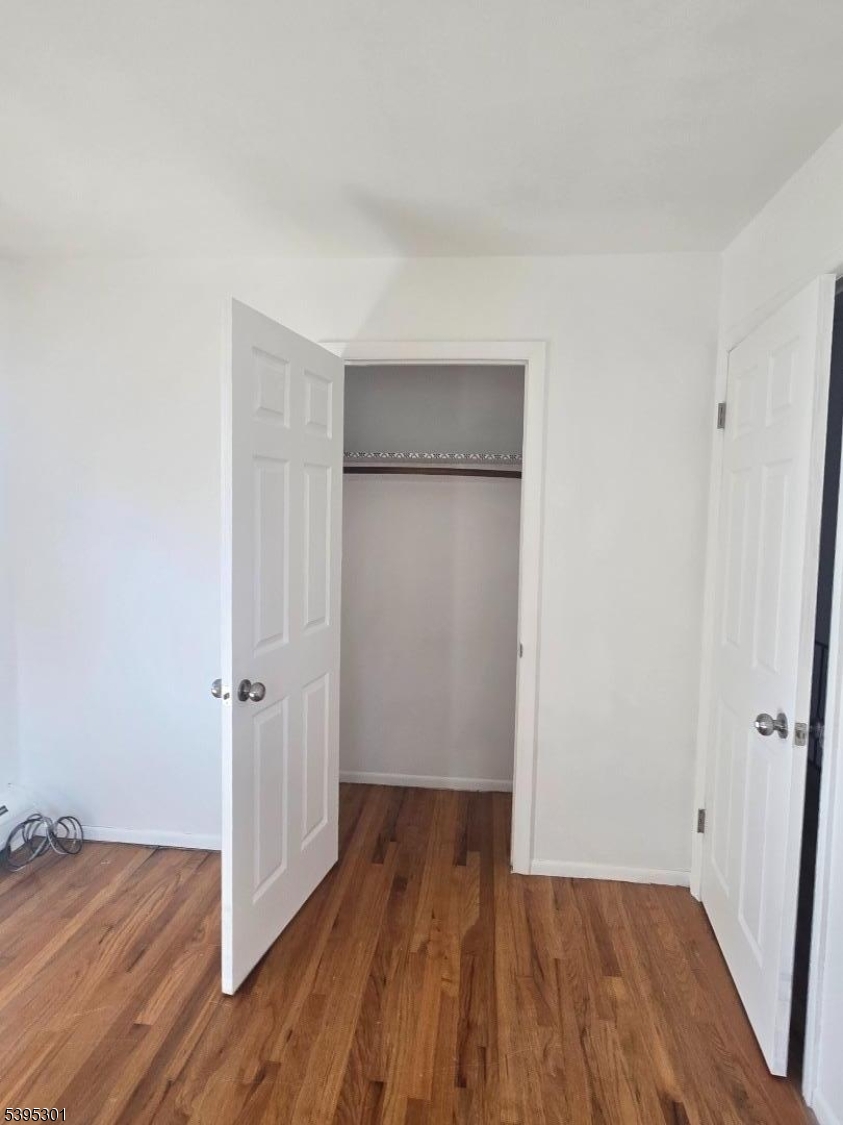 14 West Sterling Street, Unit 2 Wharton, NJ 07885 - Photo 27 of 35 wooden floor in an empty room