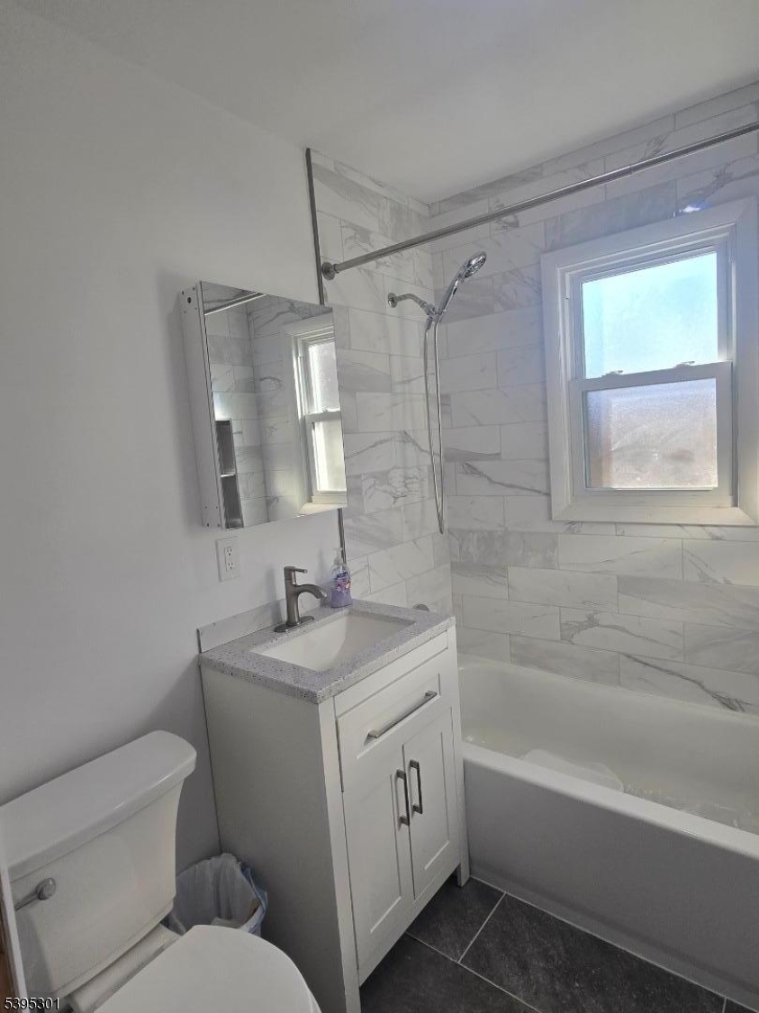 14 West Sterling Street, Unit 2 Wharton, NJ 07885 - Photo 31 of 35 a bathroom with a sink toilet vanity and bathtub