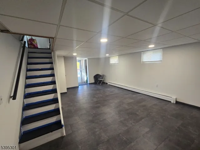 a view of a room with stairs and a window