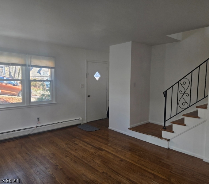 14 West Sterling Street, Unit 2 Wharton, NJ 07885 - Photo 6 of 35 an empty room with wooden floor and windows