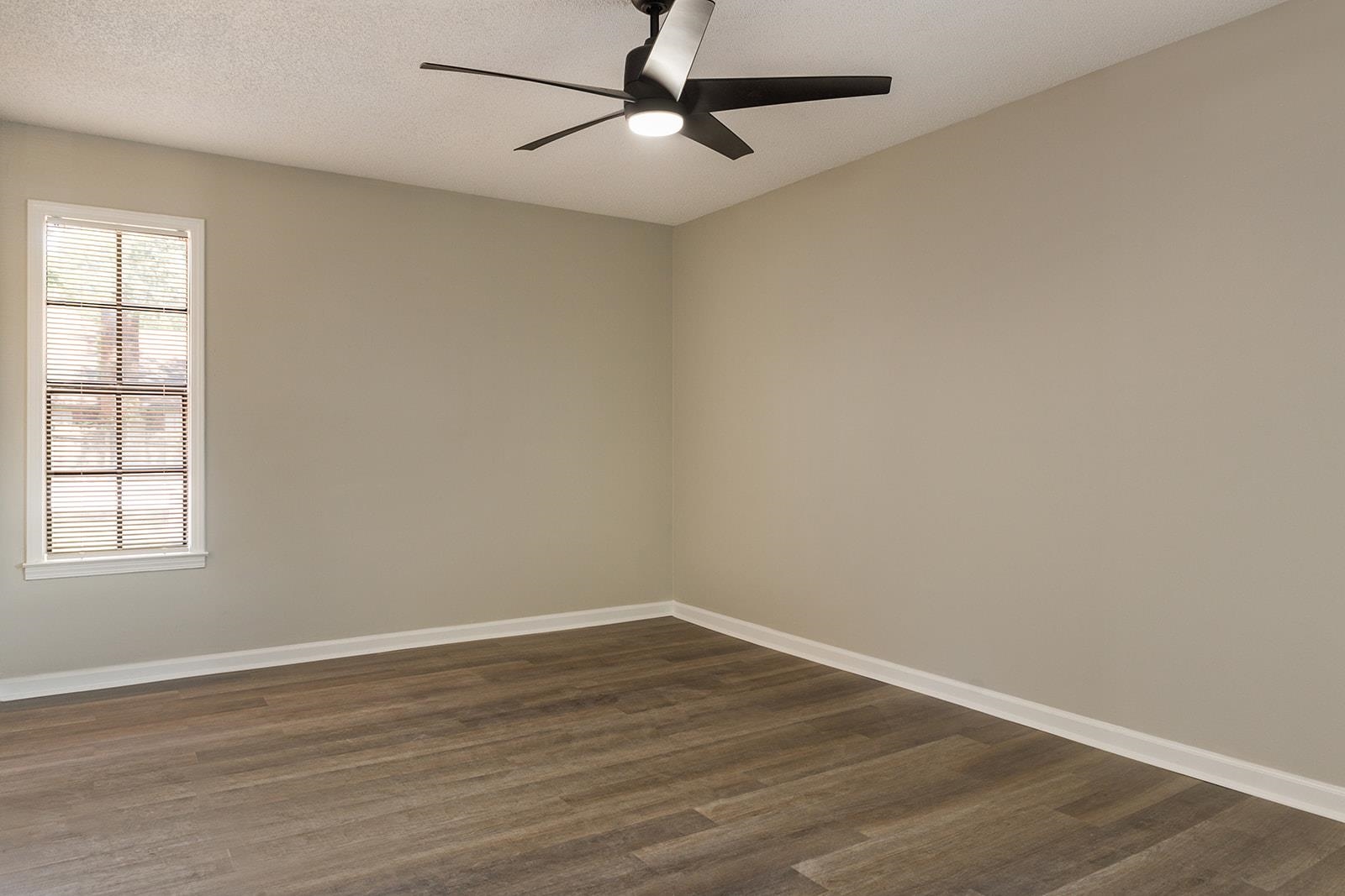 6976 Rockingham Road Memphis, TN 38125 - Photo 15 of 24 wooden floor in an empty room with a window