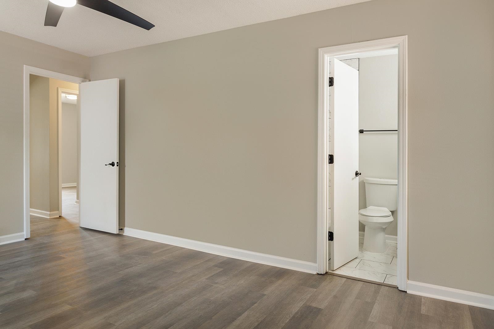 6976 Rockingham Road Memphis, TN 38125 - Photo 16 of 24 an empty room and a bathroom with a sink