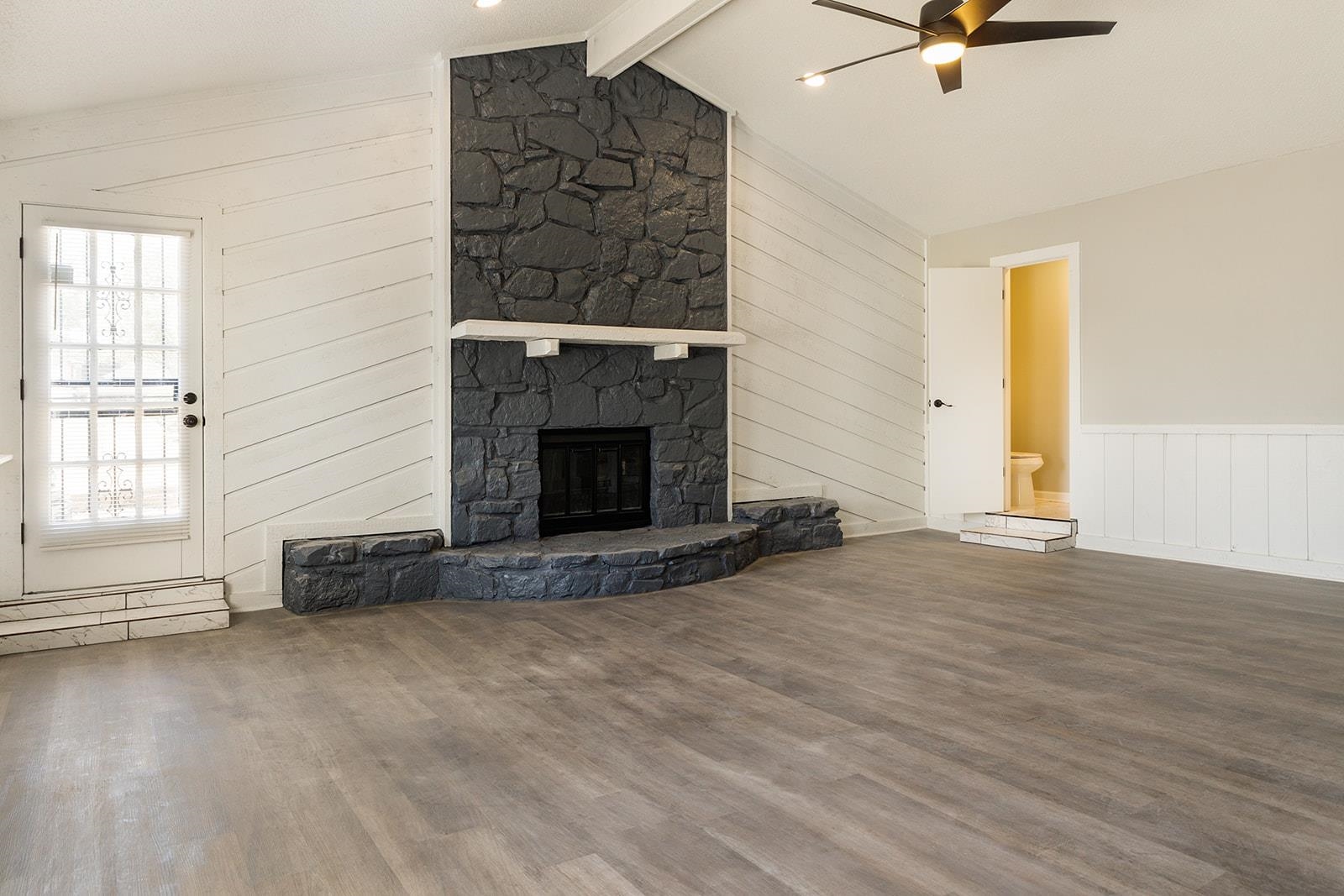 6976 Rockingham Road Memphis, TN 38125 - Photo 20 of 24 an empty room with windows and fireplace