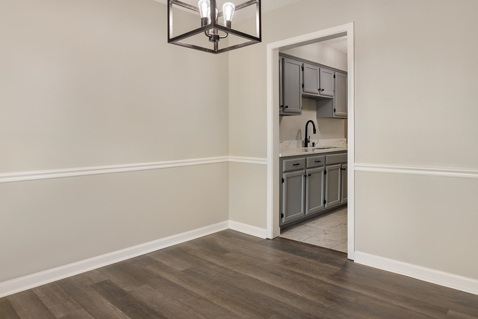 6976 Rockingham Road Memphis, TN 38125 - Photo 6 of 24 an empty room with wooden floor closet and windows