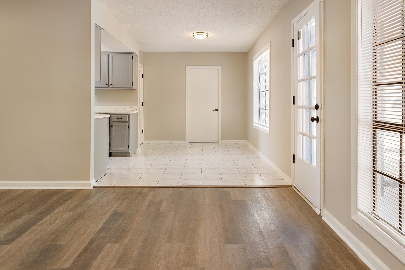 6976 Rockingham Road Memphis, TN 38125 - Photo 7 of 24 a view of a kitchen with wooden floor and a window