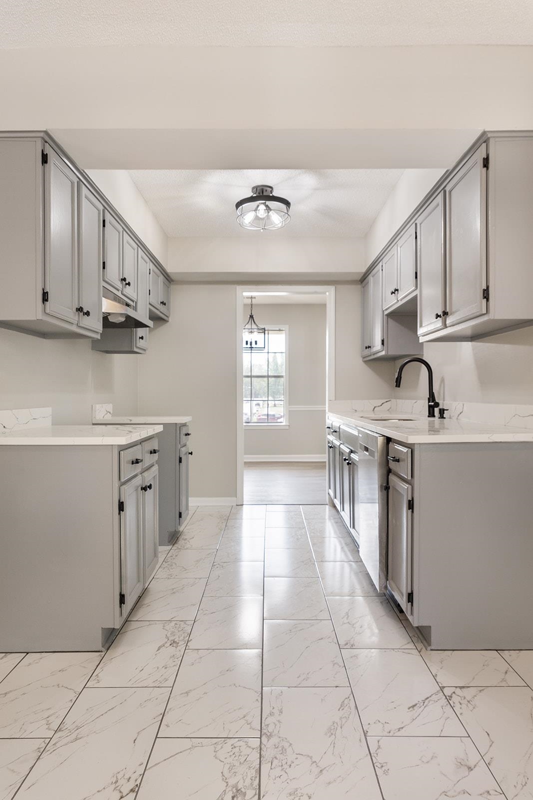 6976 Rockingham Road Memphis, TN 38125 - Photo 9 of 24 a kitchen with stainless steel appliances granite countertop a sink stove and cabinets
