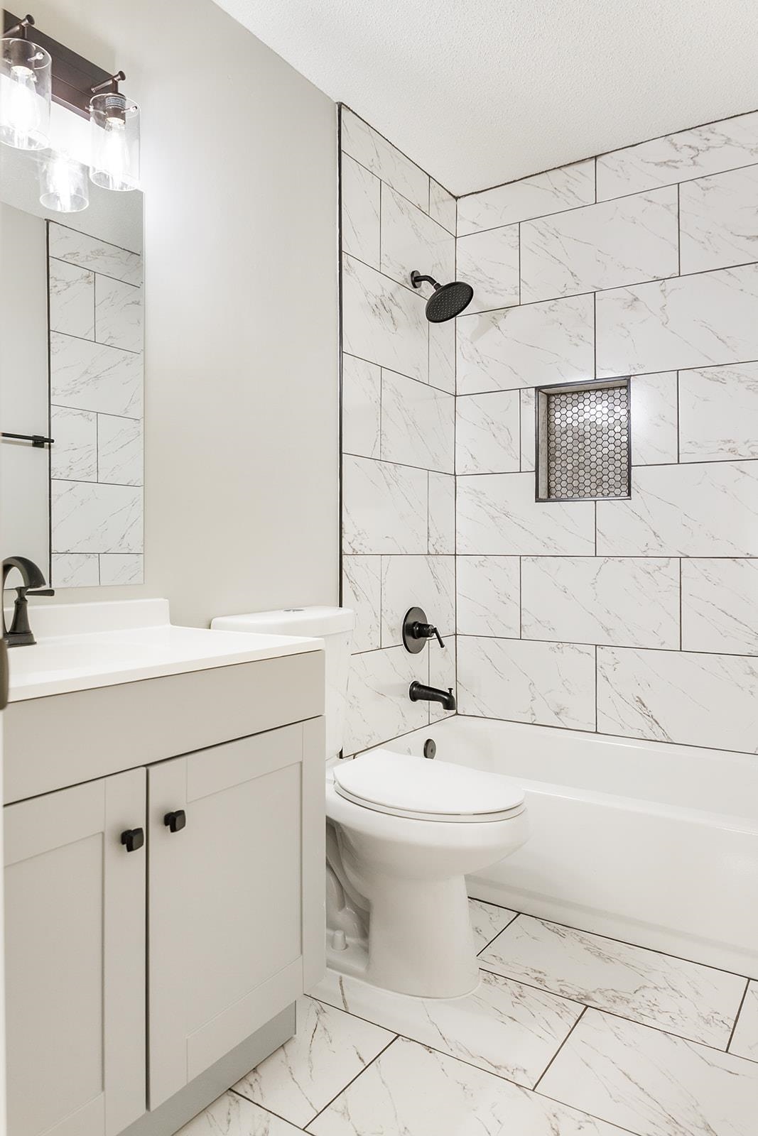 6976 Rockingham Road Memphis, TN 38125 - Photo 10 of 24 a bathroom with a sink toilet and shower