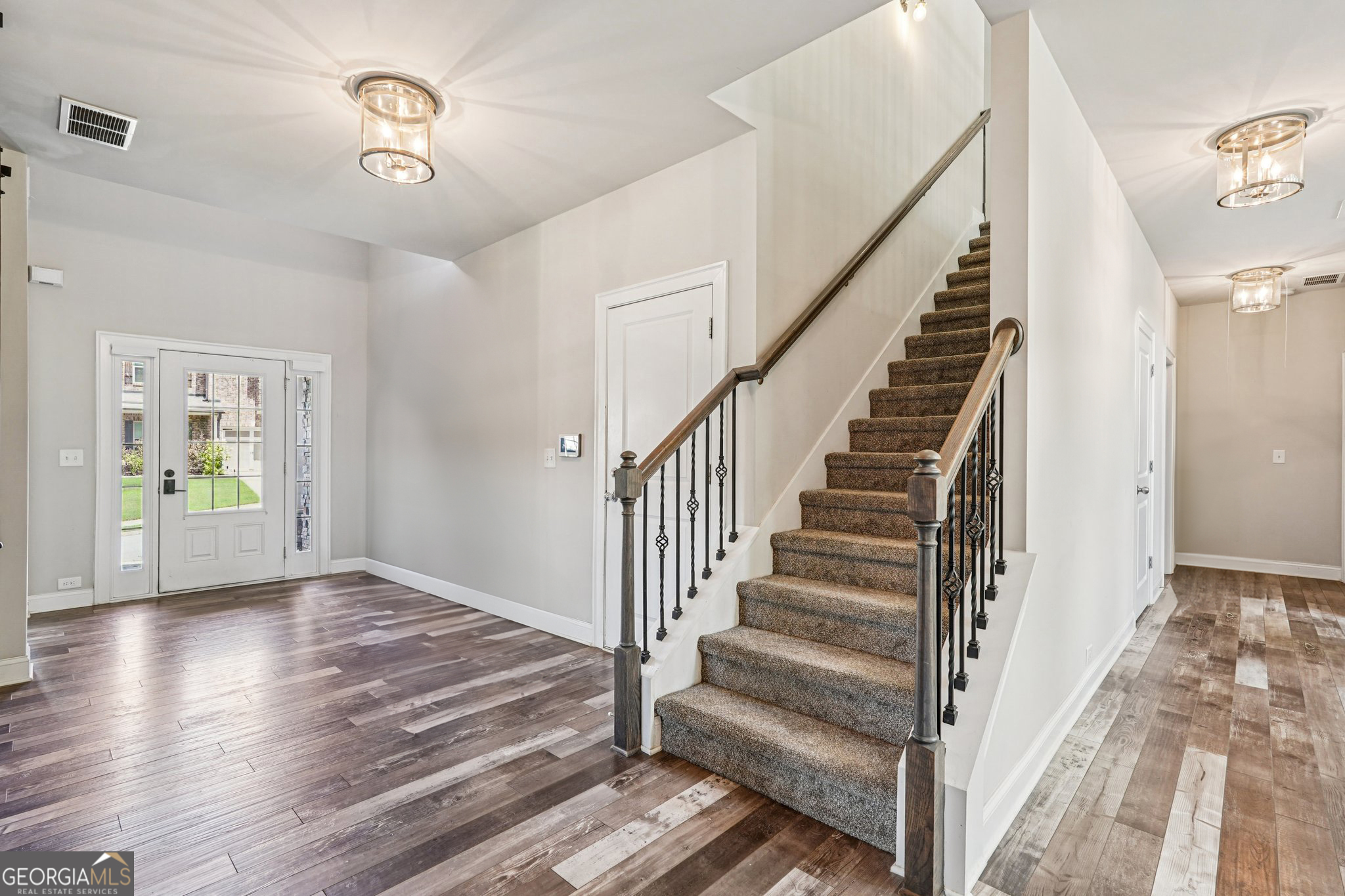 17 Lake Sydney Drive Dawsonville, GA 30534 - Photo 26 of 100 a view of entryway with wooden floor and stairs
