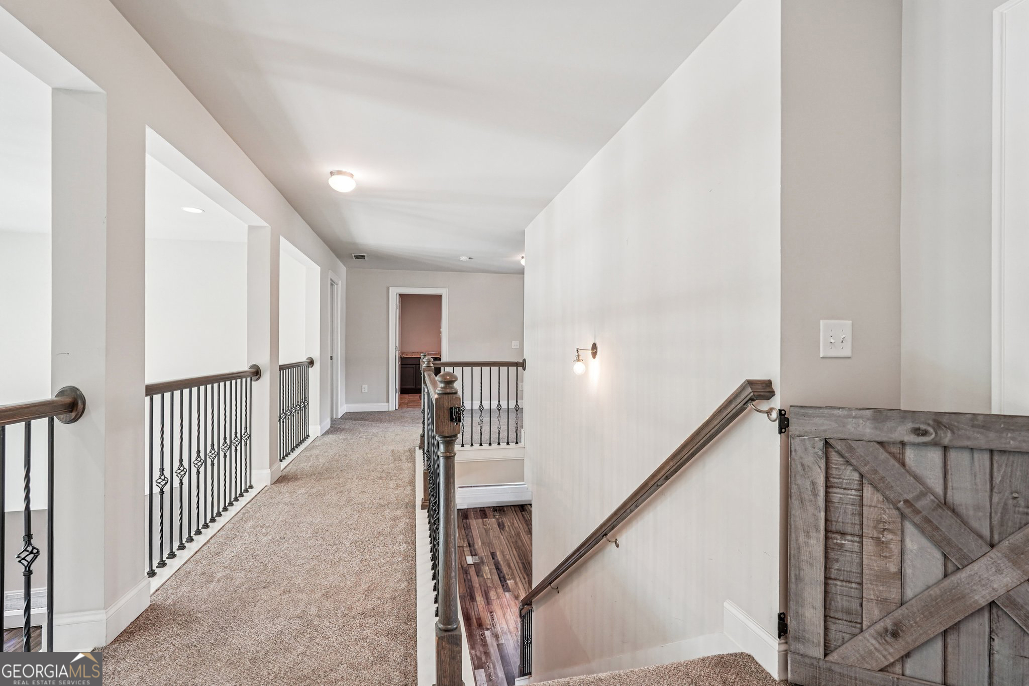 17 Lake Sydney Drive Dawsonville, GA 30534 - Photo 32 of 100 a view of a hallway with wooden floor and stairs