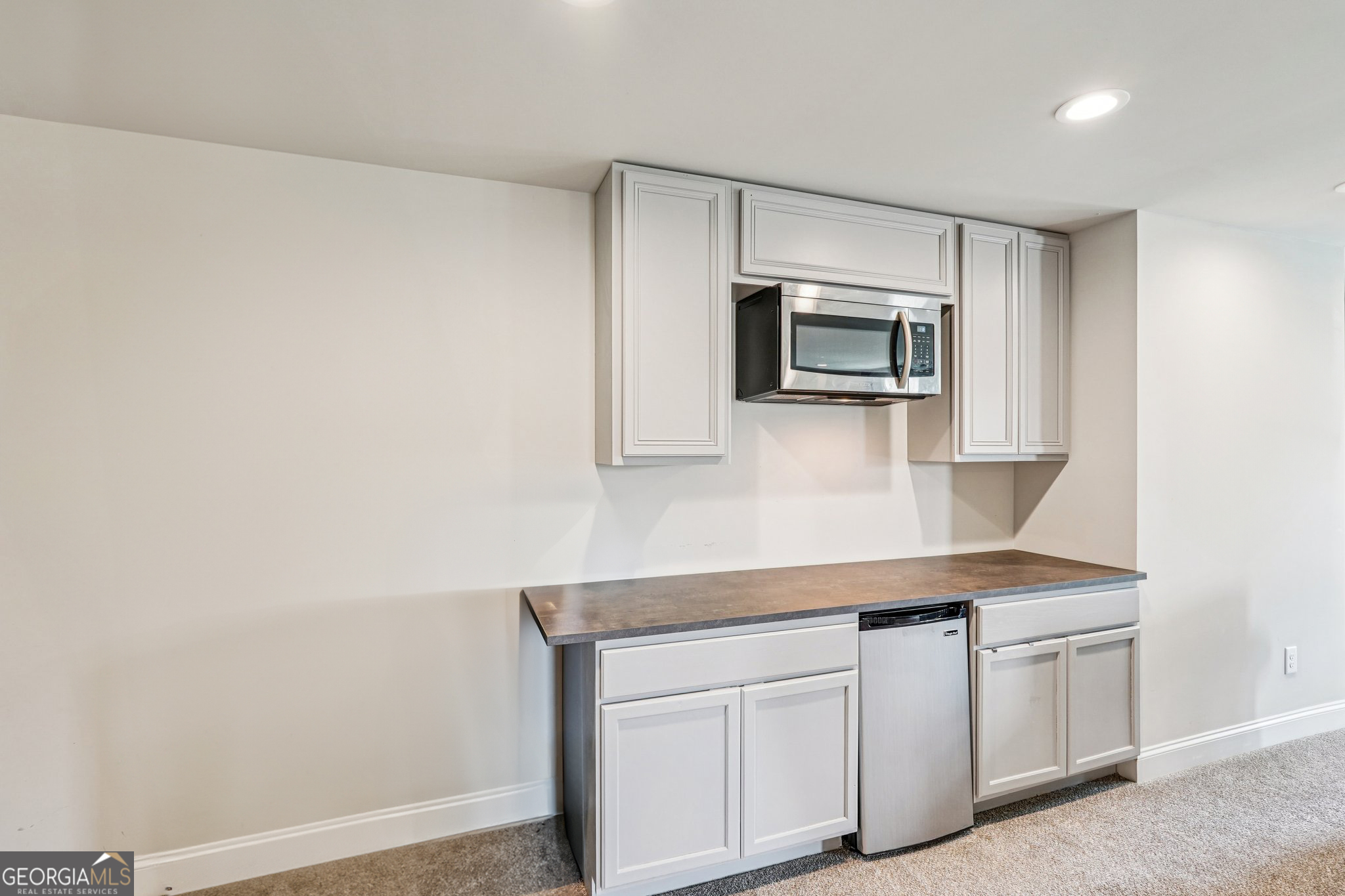 17 Lake Sydney Drive Dawsonville, GA 30534 - Photo 56 of 100 a kitchen with cabinets stainless steel appliances and wooden floor