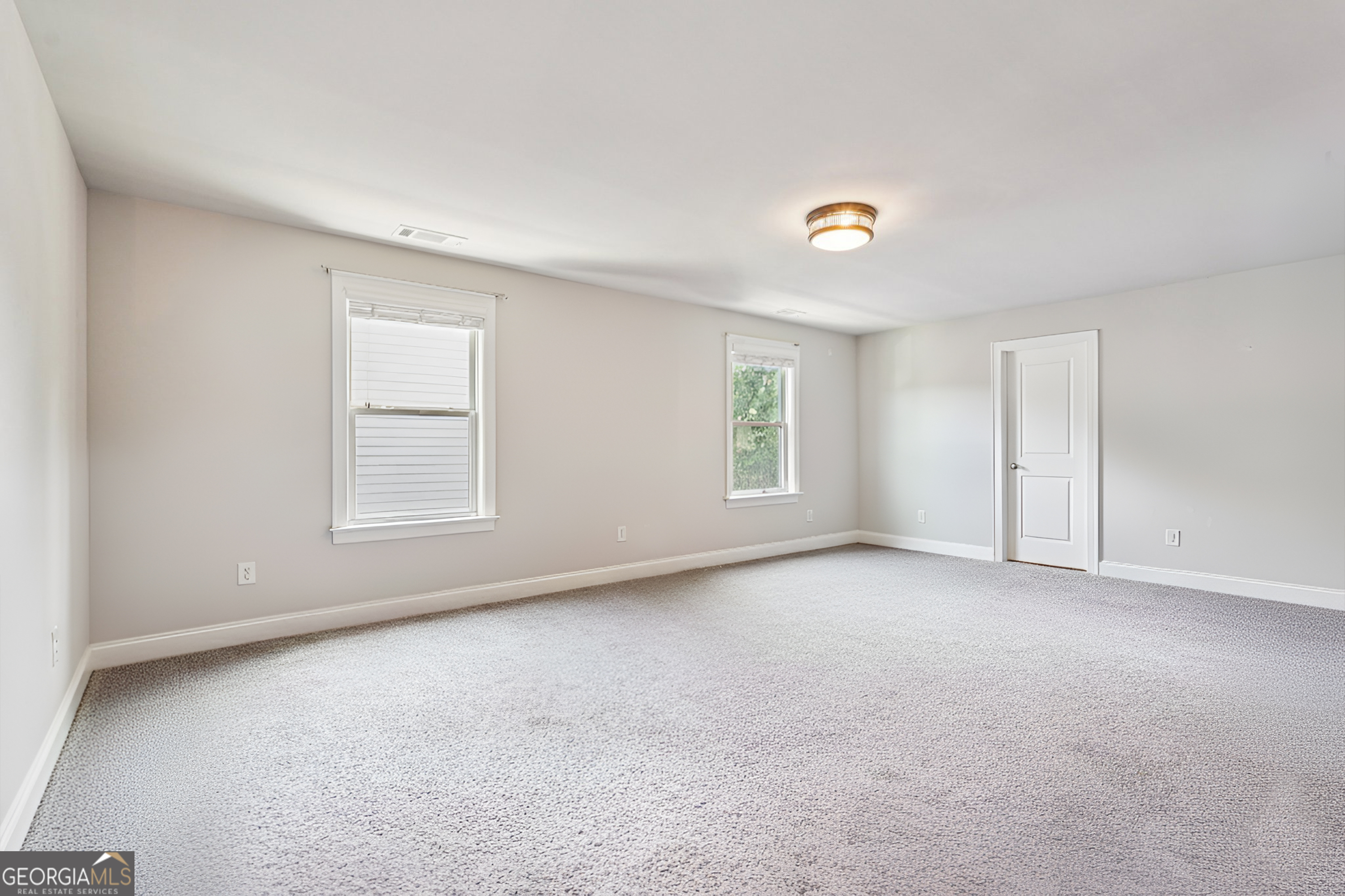 17 Lake Sydney Drive Dawsonville, GA 30534 - Photo 62 of 100 an empty room with windows and closet