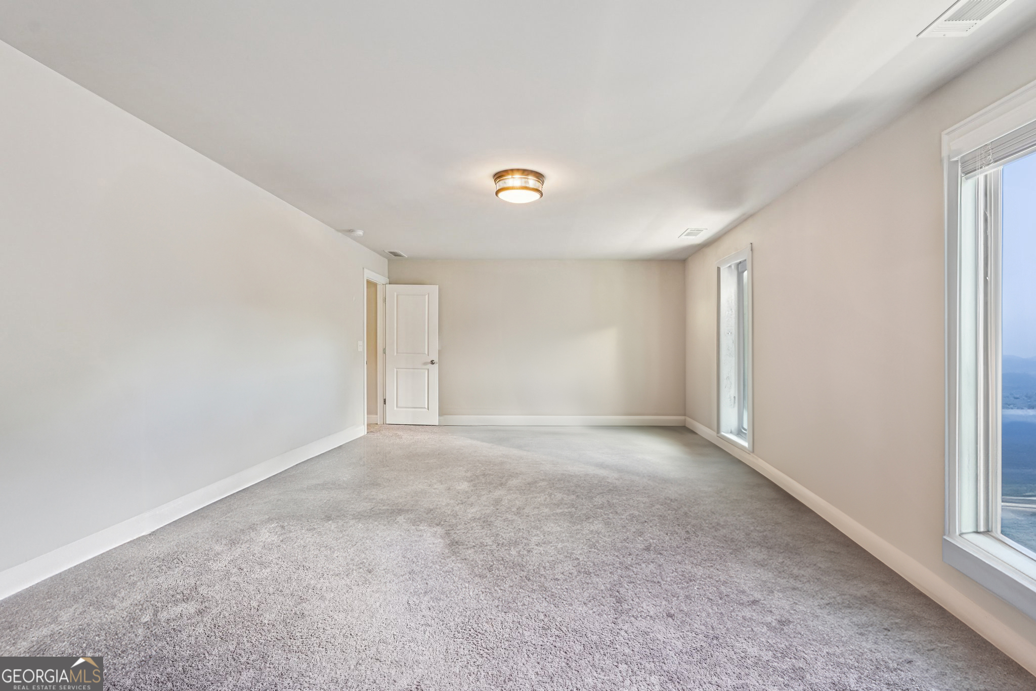 17 Lake Sydney Drive Dawsonville, GA 30534 - Photo 64 of 100 a view of an empty room with a window