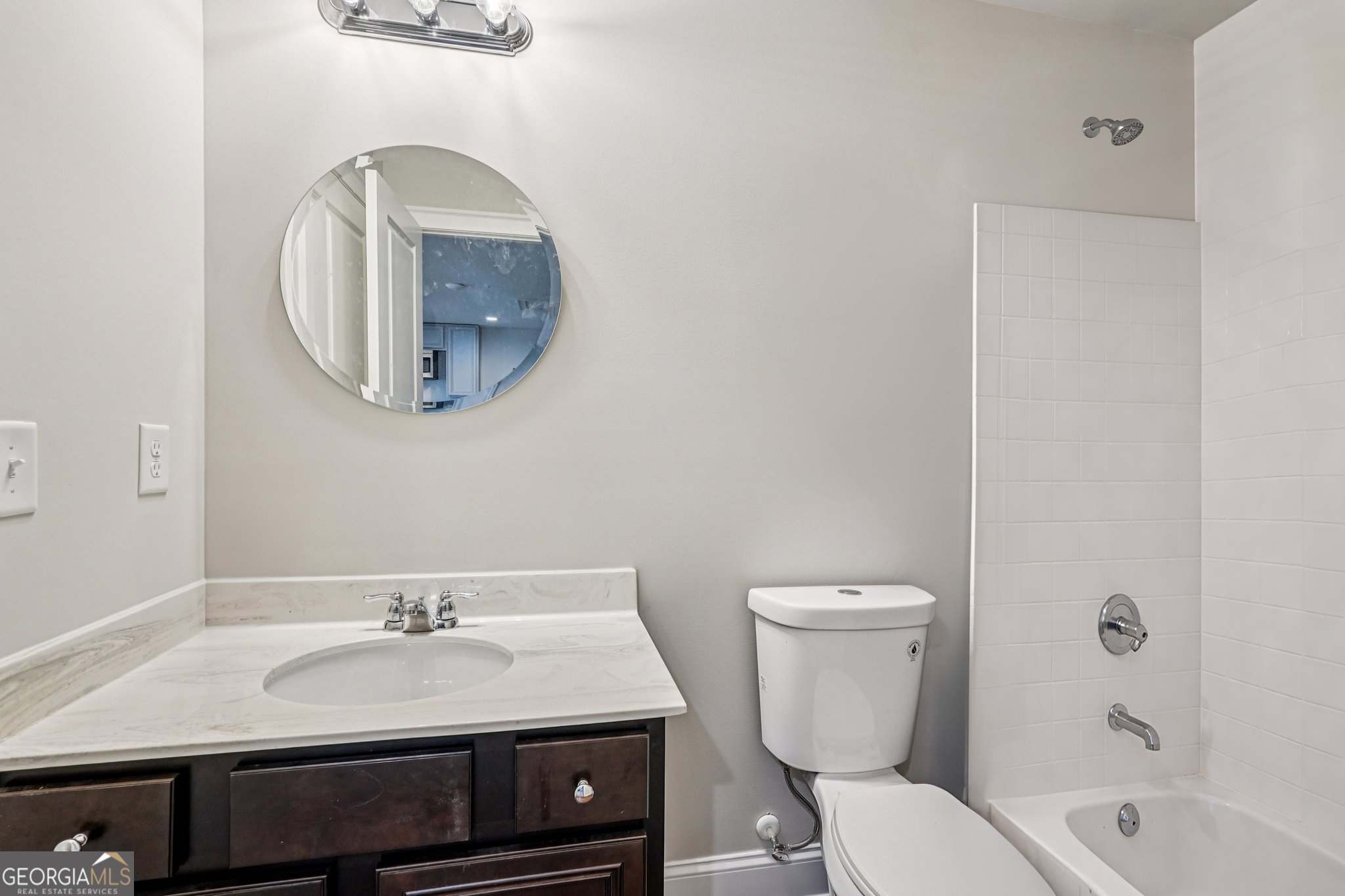 17 Lake Sydney Drive Dawsonville, GA 30534 - Photo 65 of 100 a bathroom with a toilet a sink and mirror